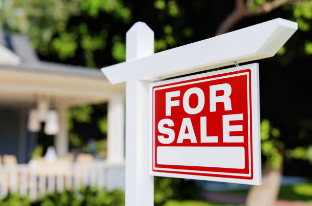For Sale sign in front of a house